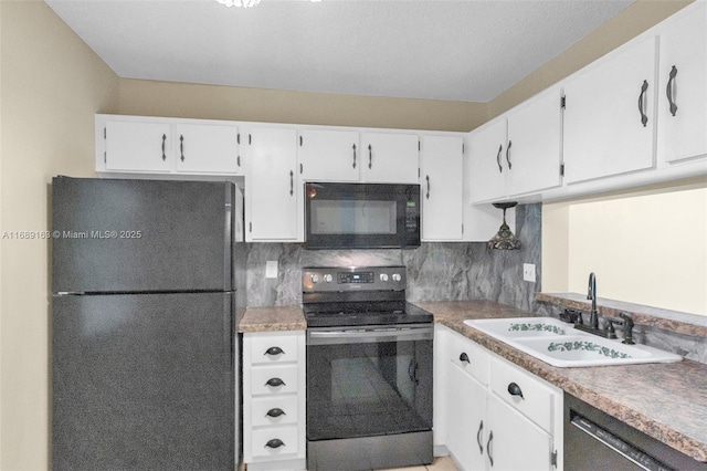 kitchen featuring sink, decorative backsplash, black appliances, and white cabinets