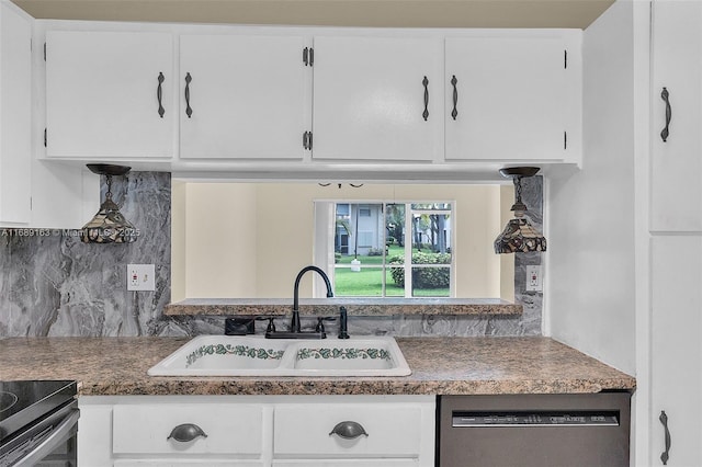 kitchen featuring dishwasher, sink, and white cabinets