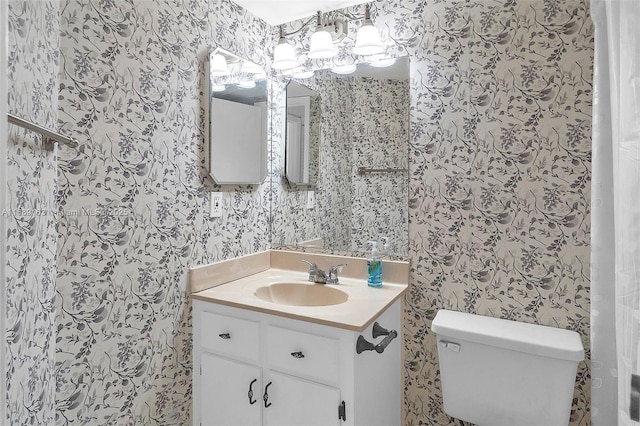 bathroom with vanity and toilet