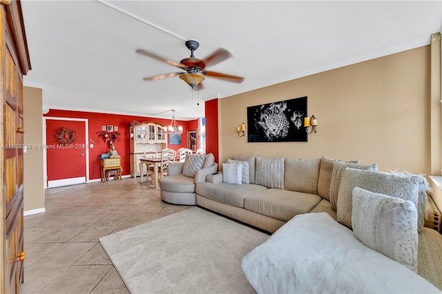 living room featuring tile patterned floors, ceiling fan, and crown molding