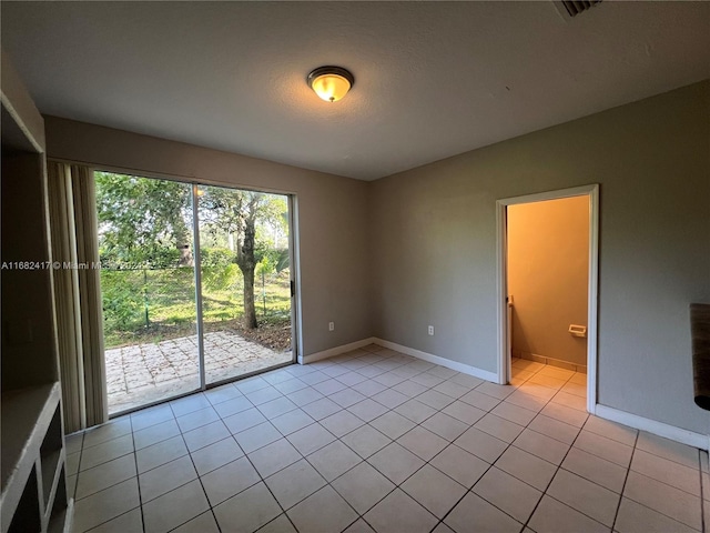 view of tiled spare room