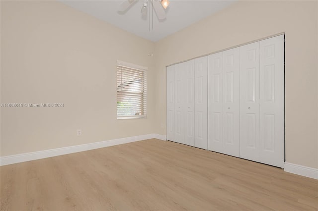 unfurnished bedroom featuring a closet, ceiling fan, and light hardwood / wood-style flooring