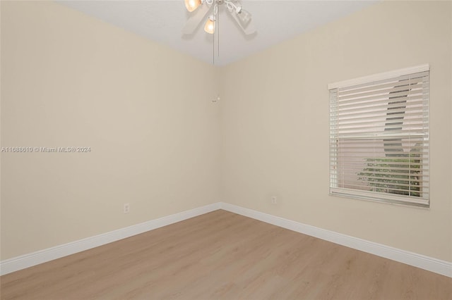 empty room featuring light hardwood / wood-style flooring and ceiling fan