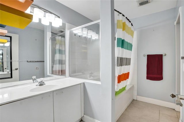 bathroom with shower / tub combo with curtain, vanity, and tile patterned flooring