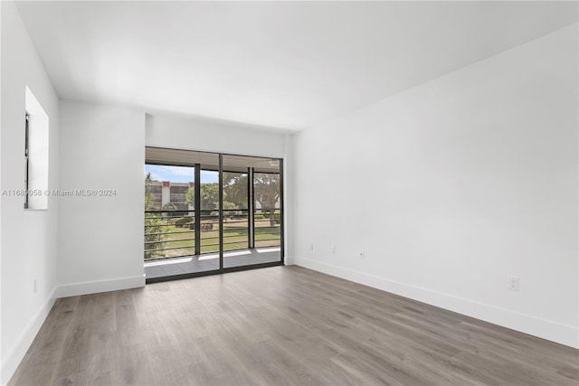 spare room featuring hardwood / wood-style floors