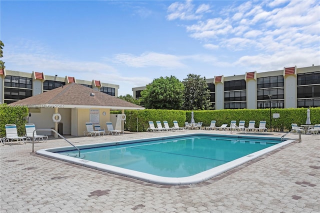 view of swimming pool with a patio