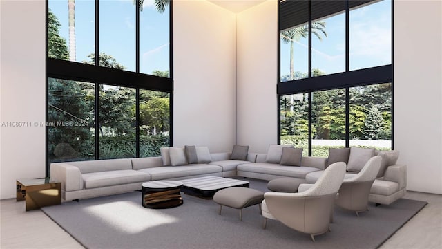 living room with a towering ceiling and a wealth of natural light