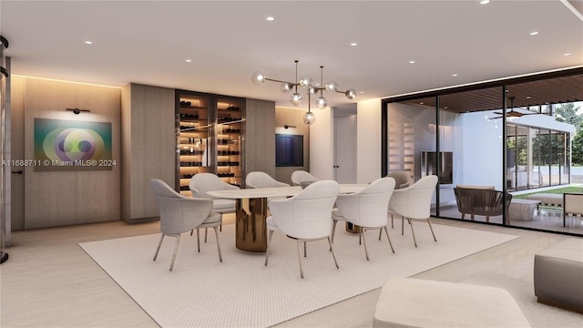 dining room with expansive windows and light hardwood / wood-style flooring