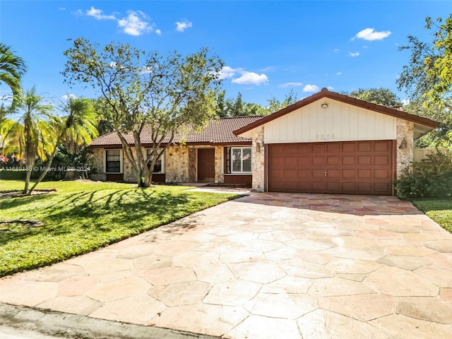 single story home with a front yard and a garage