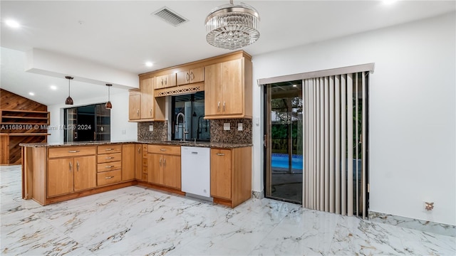 kitchen featuring sink, an inviting chandelier, kitchen peninsula, white dishwasher, and decorative light fixtures