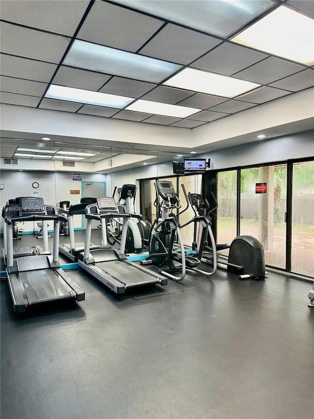 workout area featuring a drop ceiling