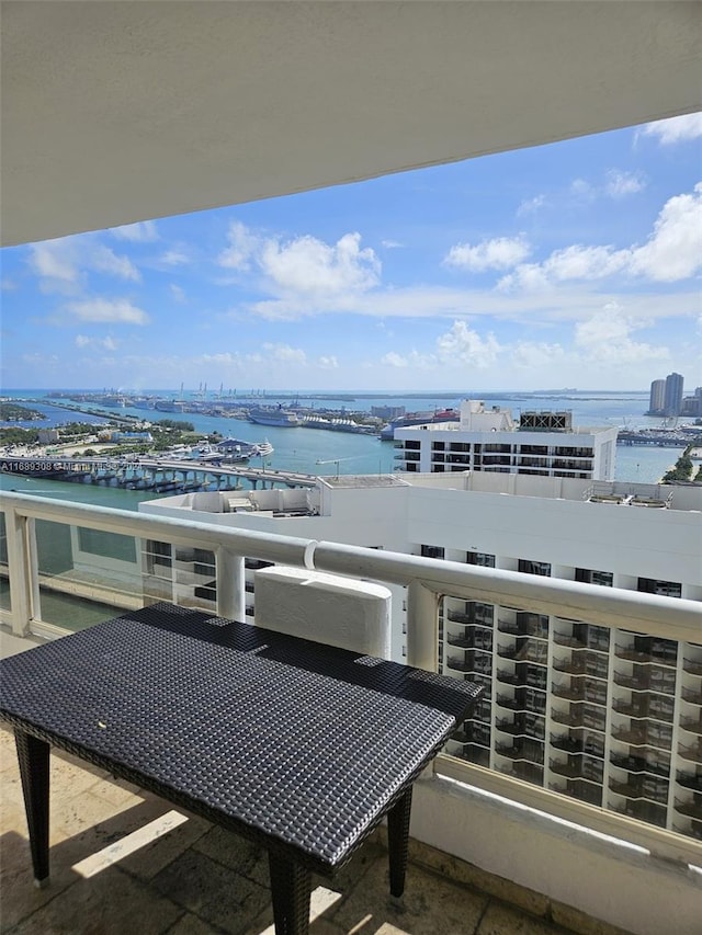 balcony featuring a water view