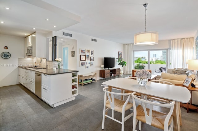 dining space with sink