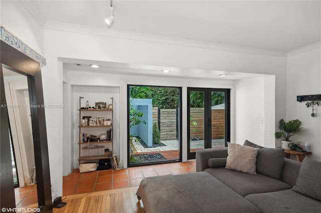 living room featuring hardwood / wood-style flooring and ornamental molding