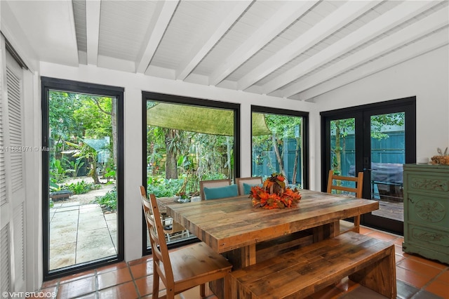 sunroom / solarium featuring french doors and vaulted ceiling with beams