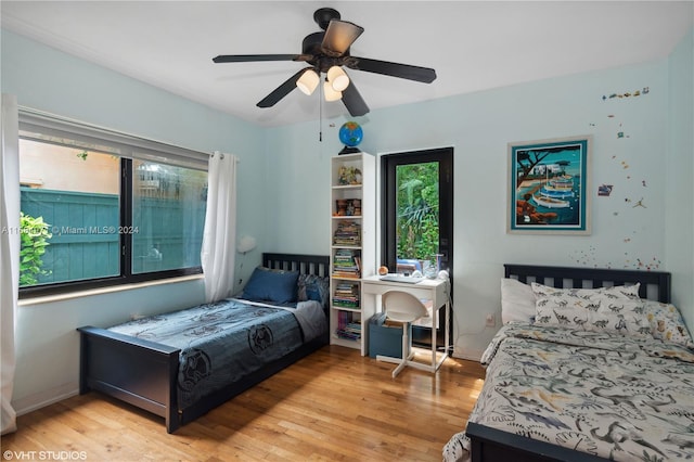 bedroom featuring light hardwood / wood-style floors and ceiling fan