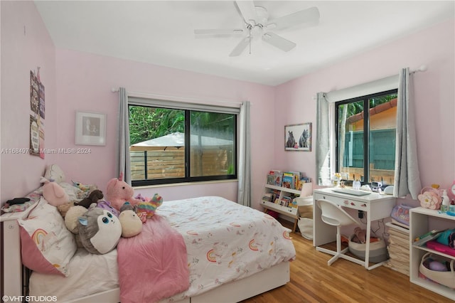 bedroom with light wood-type flooring and ceiling fan