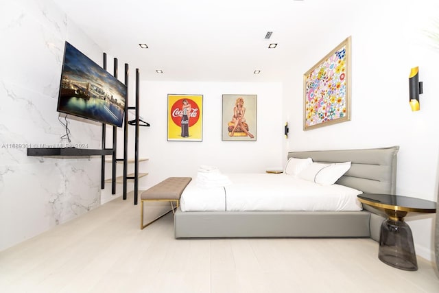 bedroom with light wood-type flooring