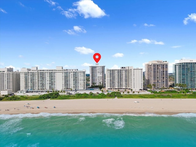 aerial view with a beach view and a water view