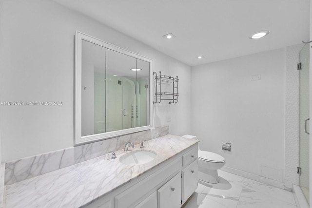 bathroom featuring toilet, a shower with door, and vanity