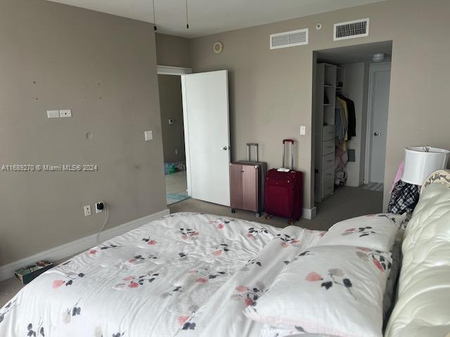 carpeted bedroom featuring a closet