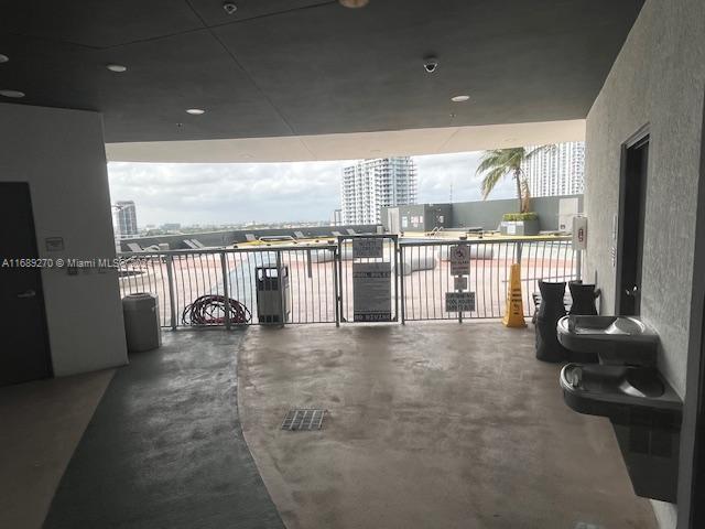 view of patio featuring a balcony