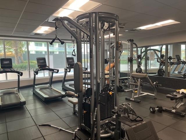 workout area featuring a drop ceiling