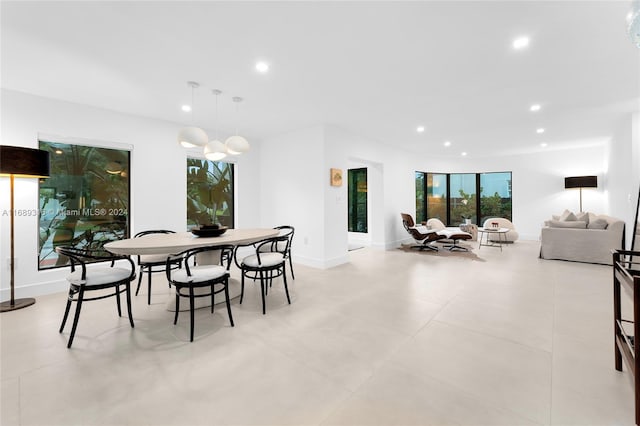 dining space with an inviting chandelier