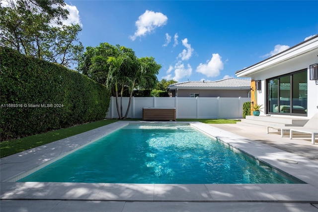 view of pool featuring a patio area