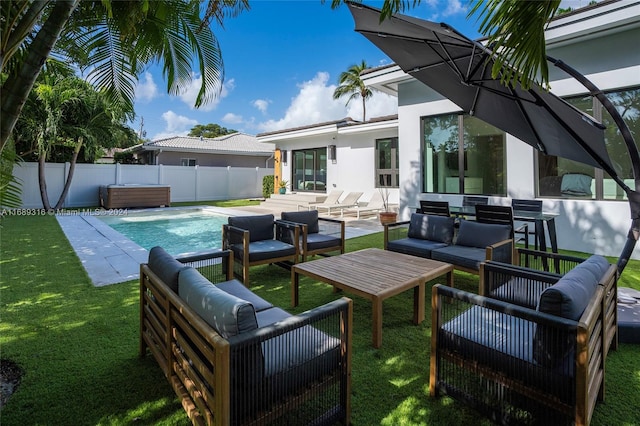 view of patio featuring outdoor lounge area and a fenced in pool