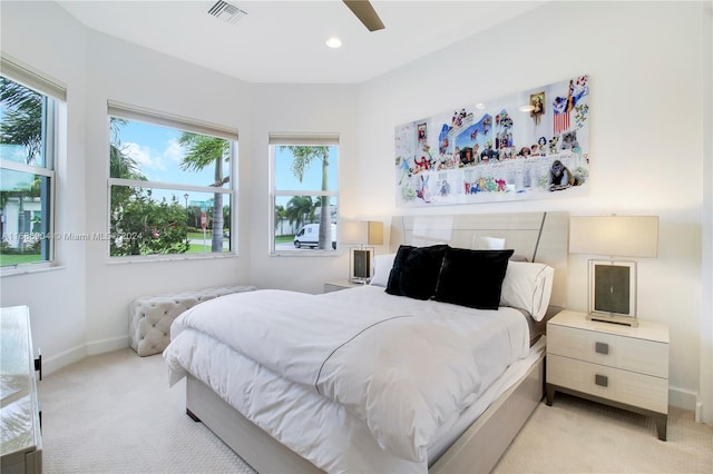 bedroom with light colored carpet and ceiling fan