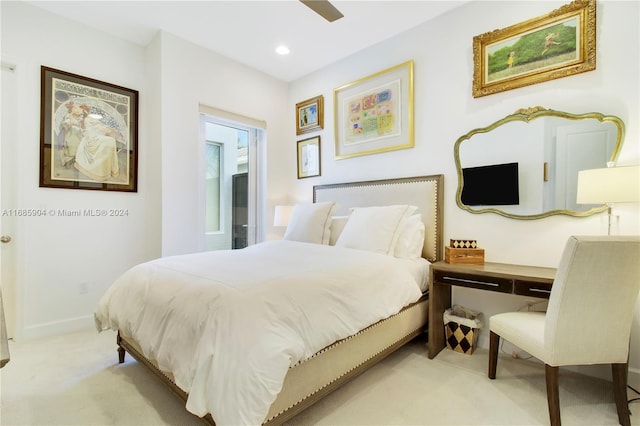 bedroom featuring ceiling fan and light carpet