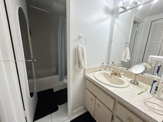 full bathroom with toilet, shower / tub combo, vanity, and tile patterned flooring