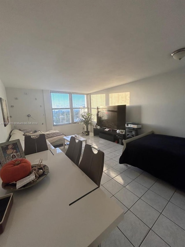 bedroom with light tile patterned floors