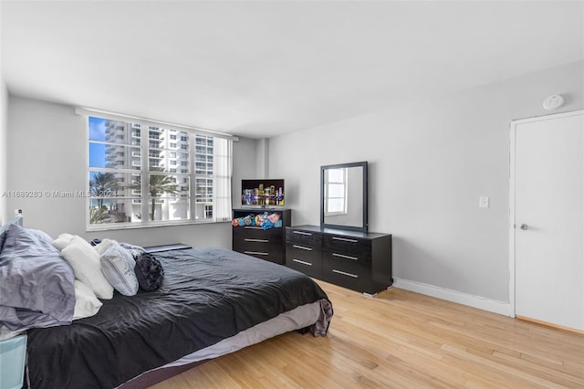 bedroom featuring light wood-type flooring