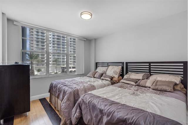 bedroom with light hardwood / wood-style floors