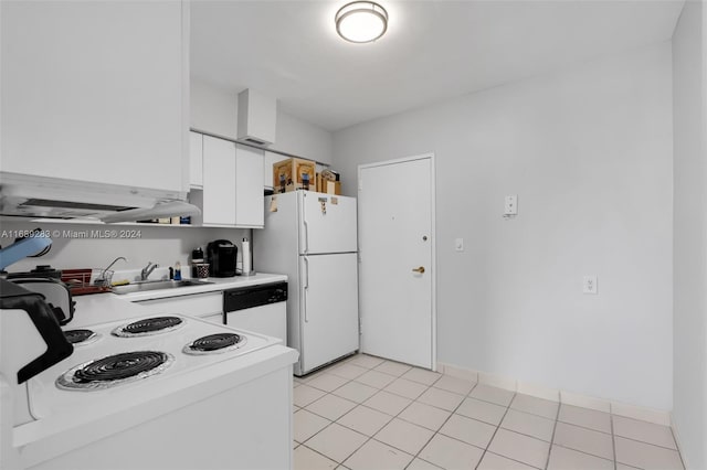 kitchen featuring light tile patterned floors, sink, white appliances, and white cabinetry