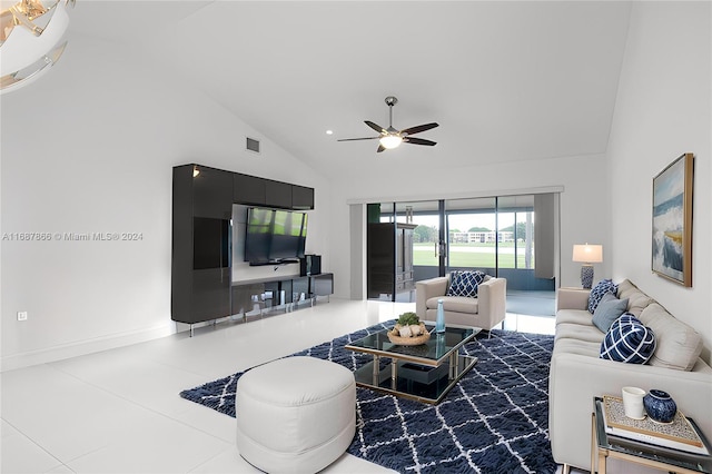 living room with tile patterned floors, ceiling fan, and high vaulted ceiling