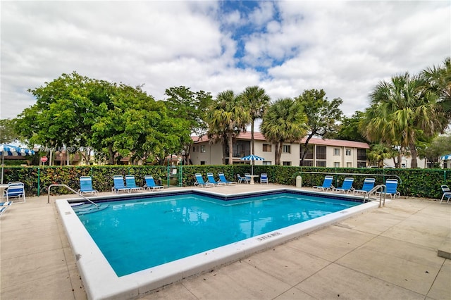 view of swimming pool with a patio area