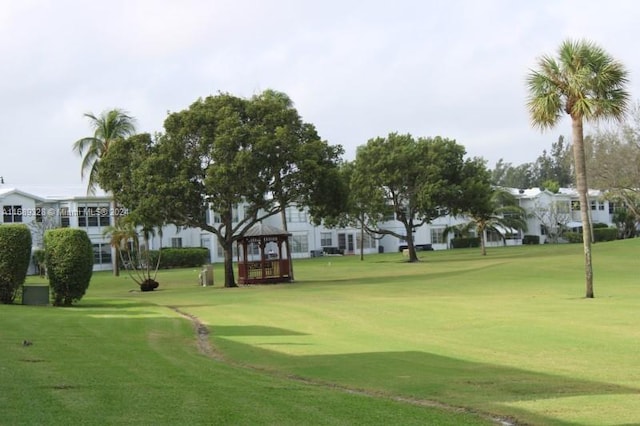 view of community with a yard and a gazebo