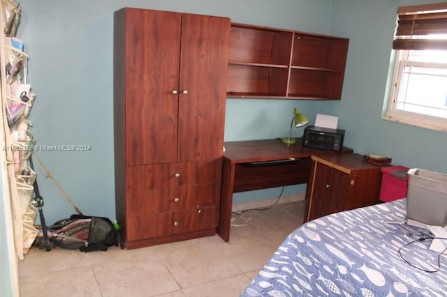 bedroom with light tile patterned flooring