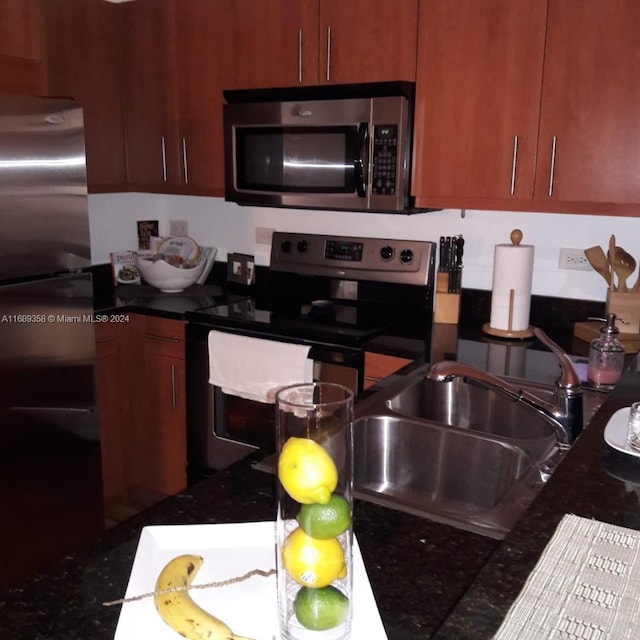 kitchen with appliances with stainless steel finishes and sink