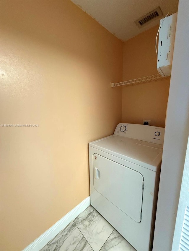 laundry area featuring washer / dryer