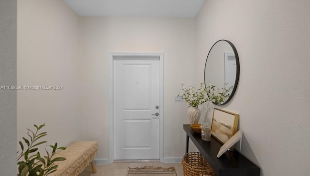 entryway with tile patterned floors