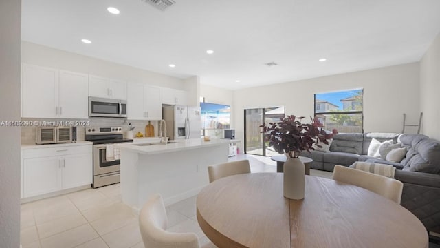 tiled dining space with sink