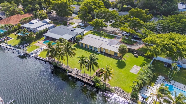 birds eye view of property with a water view