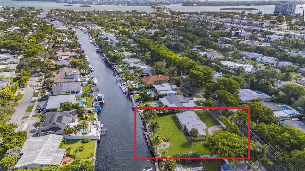 birds eye view of property featuring a water view