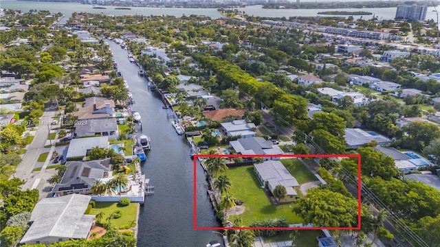 birds eye view of property featuring a water view