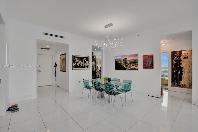 tiled dining area with an inviting chandelier