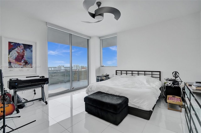 tiled bedroom featuring access to outside, floor to ceiling windows, and ceiling fan